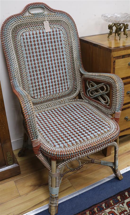 An unusual Perrett and Viber Paris, white, blue and orange rattan armchair